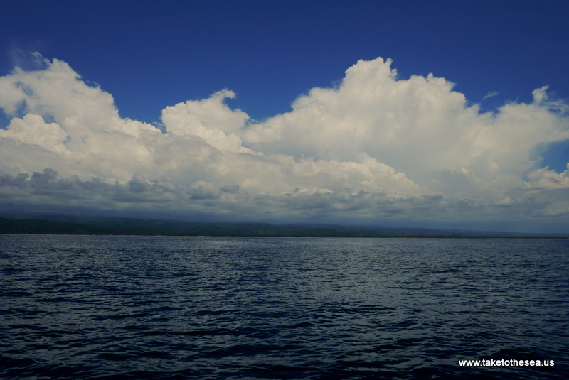 Clouds stacking up on land.